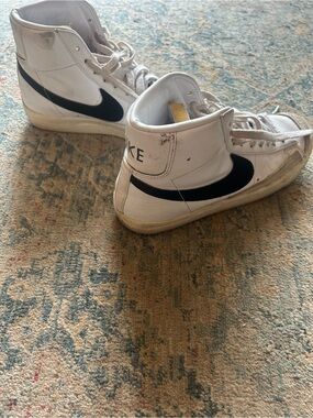 Nike White High-Top Sneakers with Black Swoosh Accents
